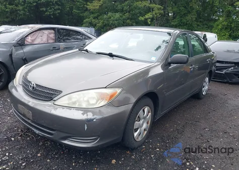 2003 Toyota Camry Le z USA, uszkodzony, nr VIN 4T1BE32K03U700748